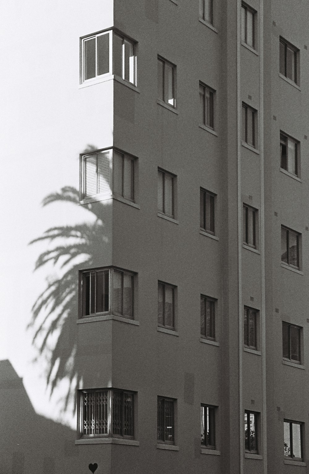 a black and white photo of a tall building