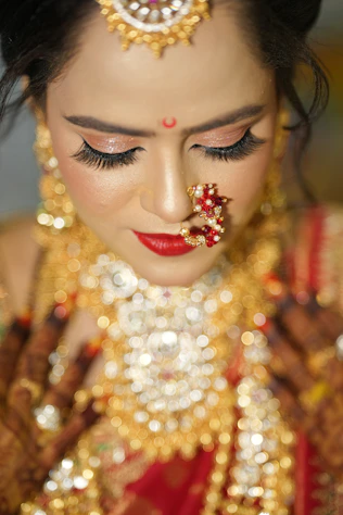 a woman wearing a gold and red outfit