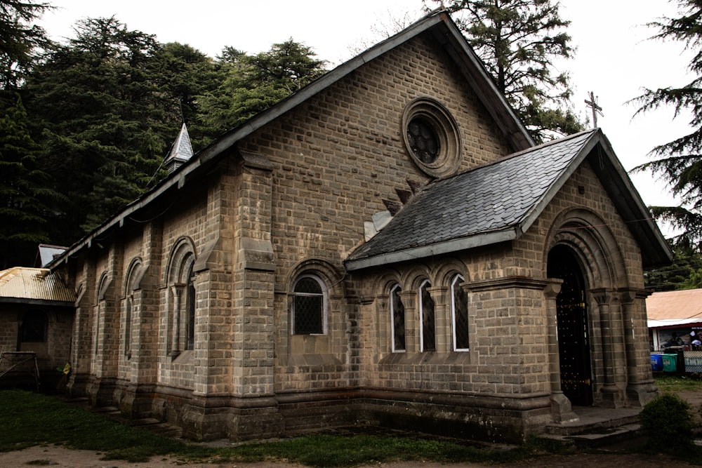 an old church with a steeple and a clock tower