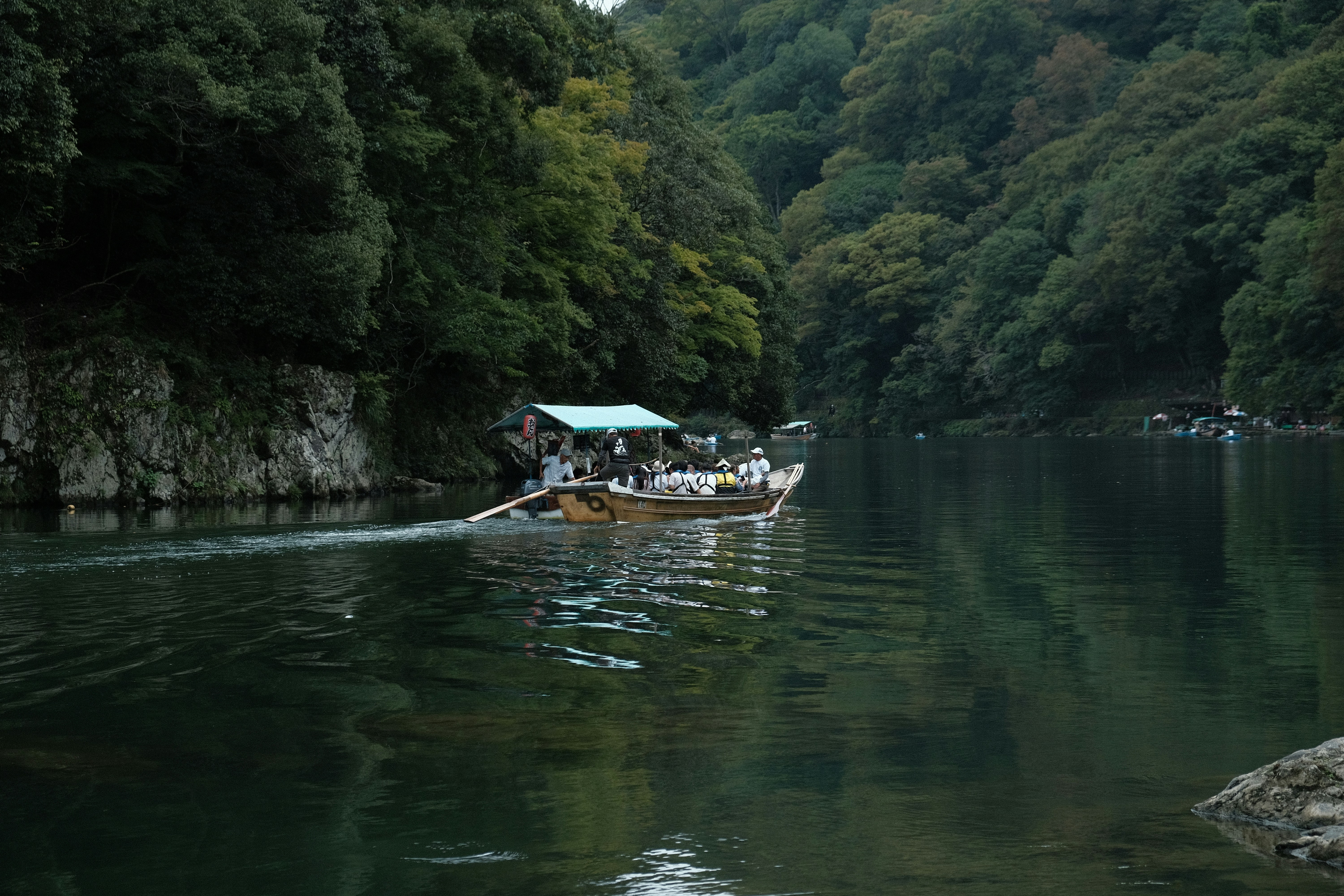 a group of people in a boat on a river
