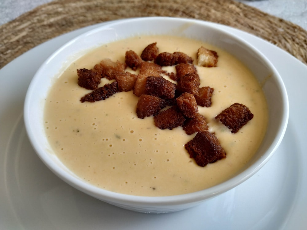 a bowl of soup with bacon bits in it