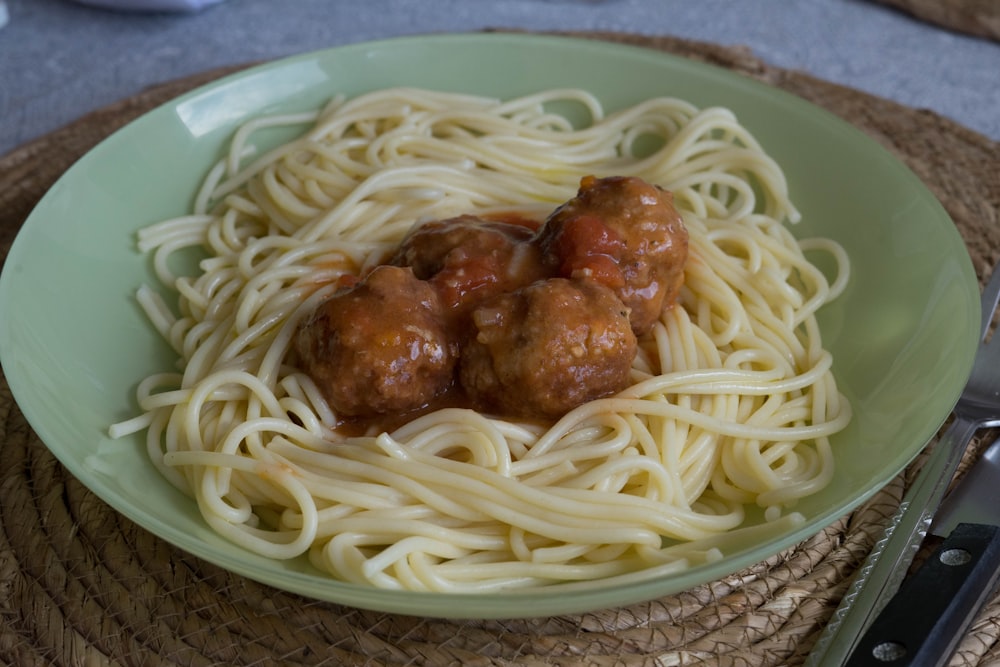a plate of spaghetti with meatballs on it