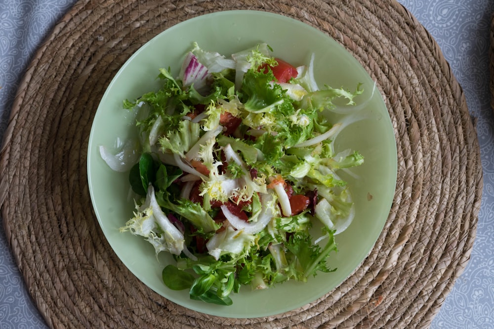 a plate of salad on a place mat