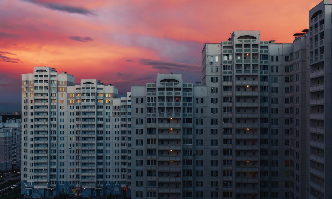 Urban house at sunset. Beautiful sunset in the city in the foreground a house