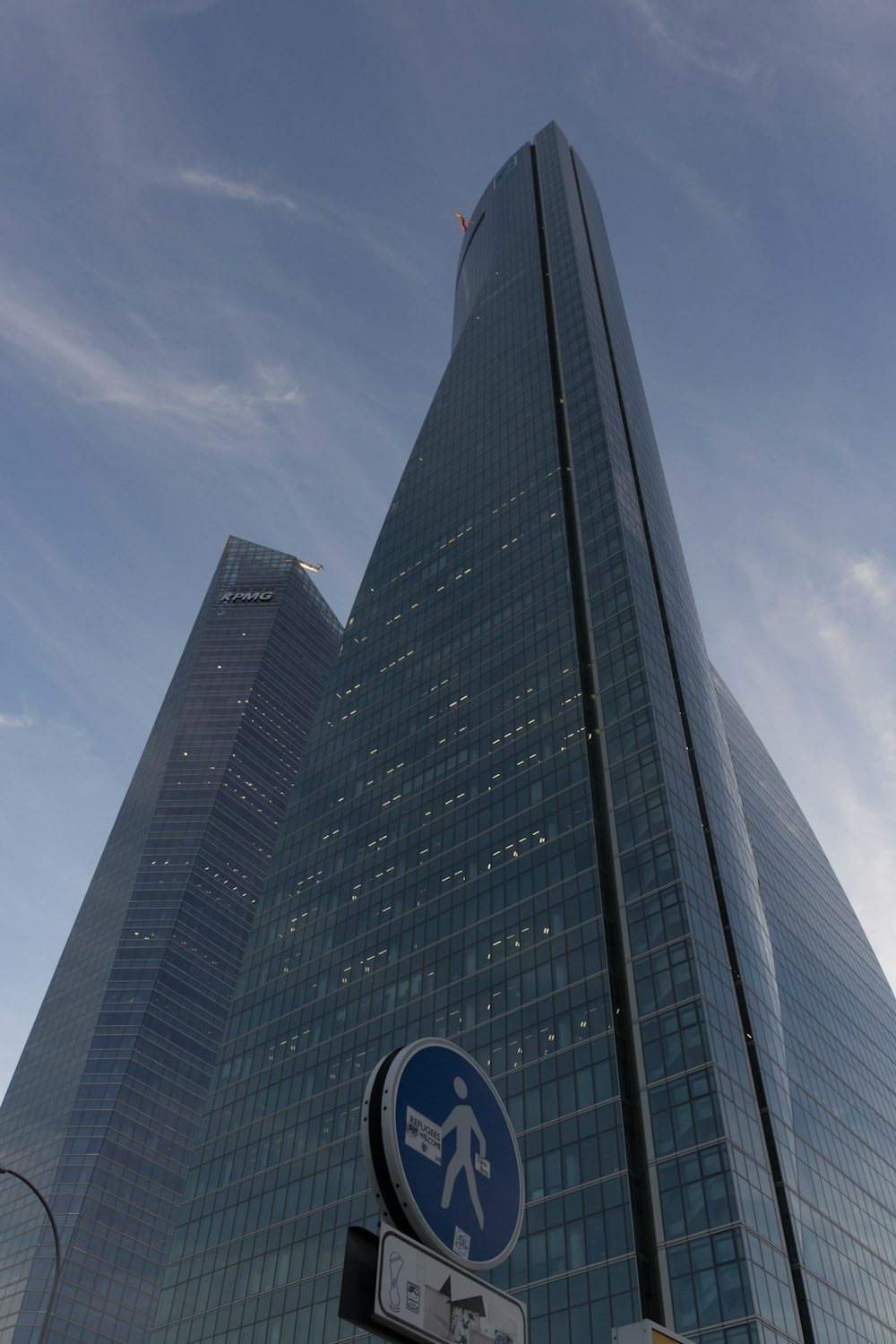 a tall building with a blue sky in the background