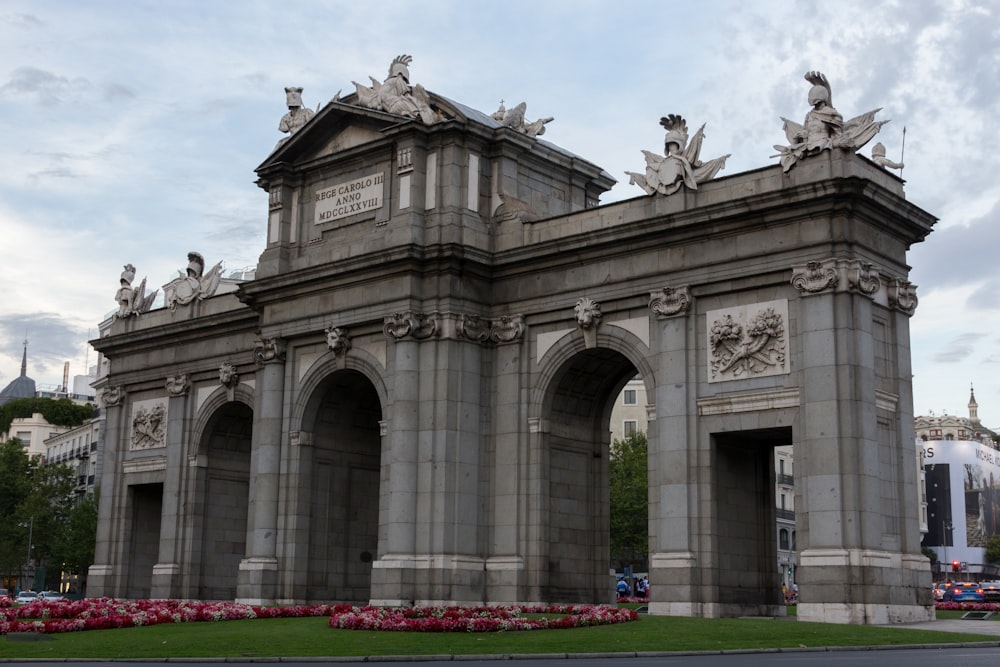 a large arch with statues on top of it