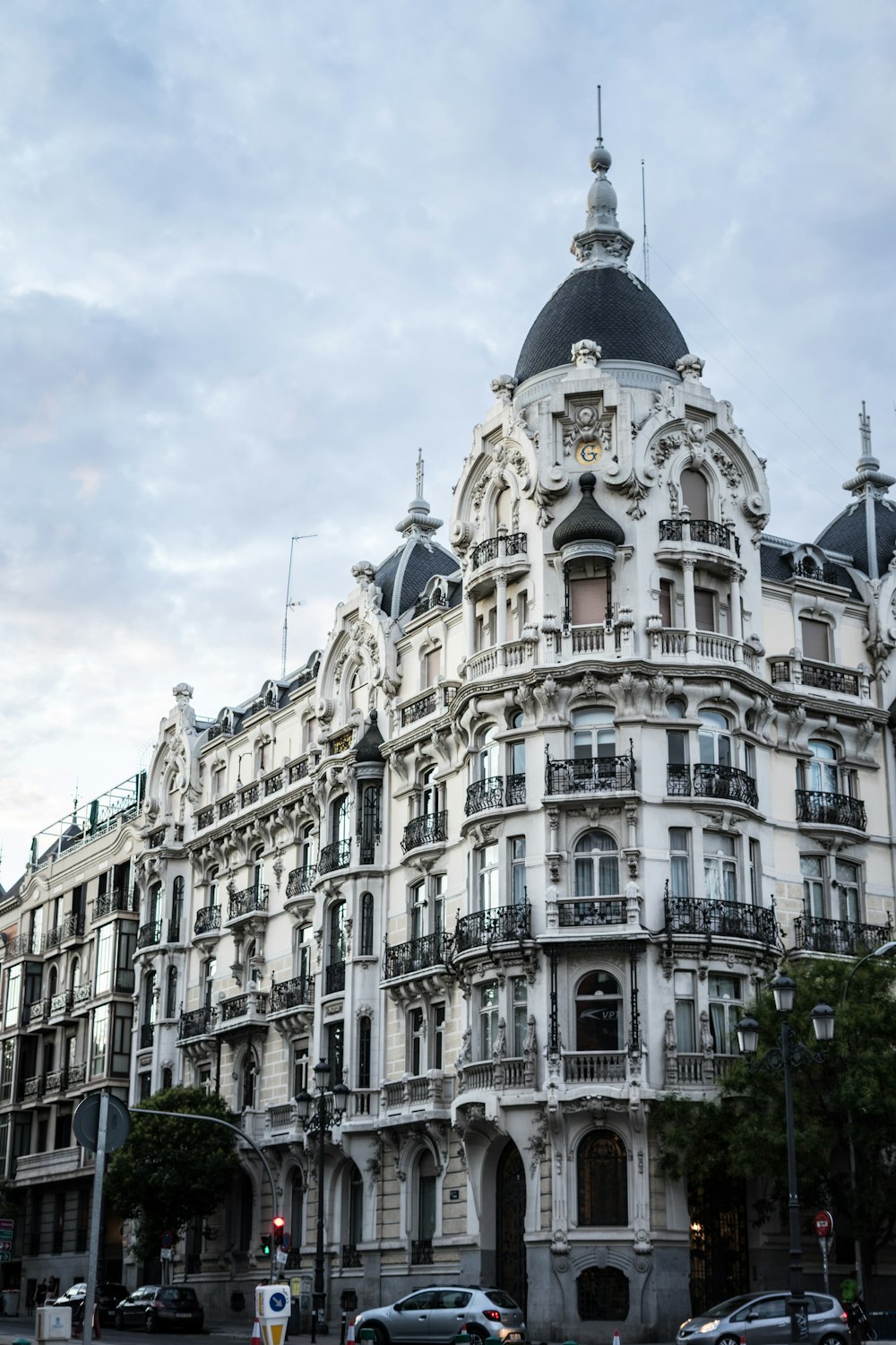 a large white building with many balconies