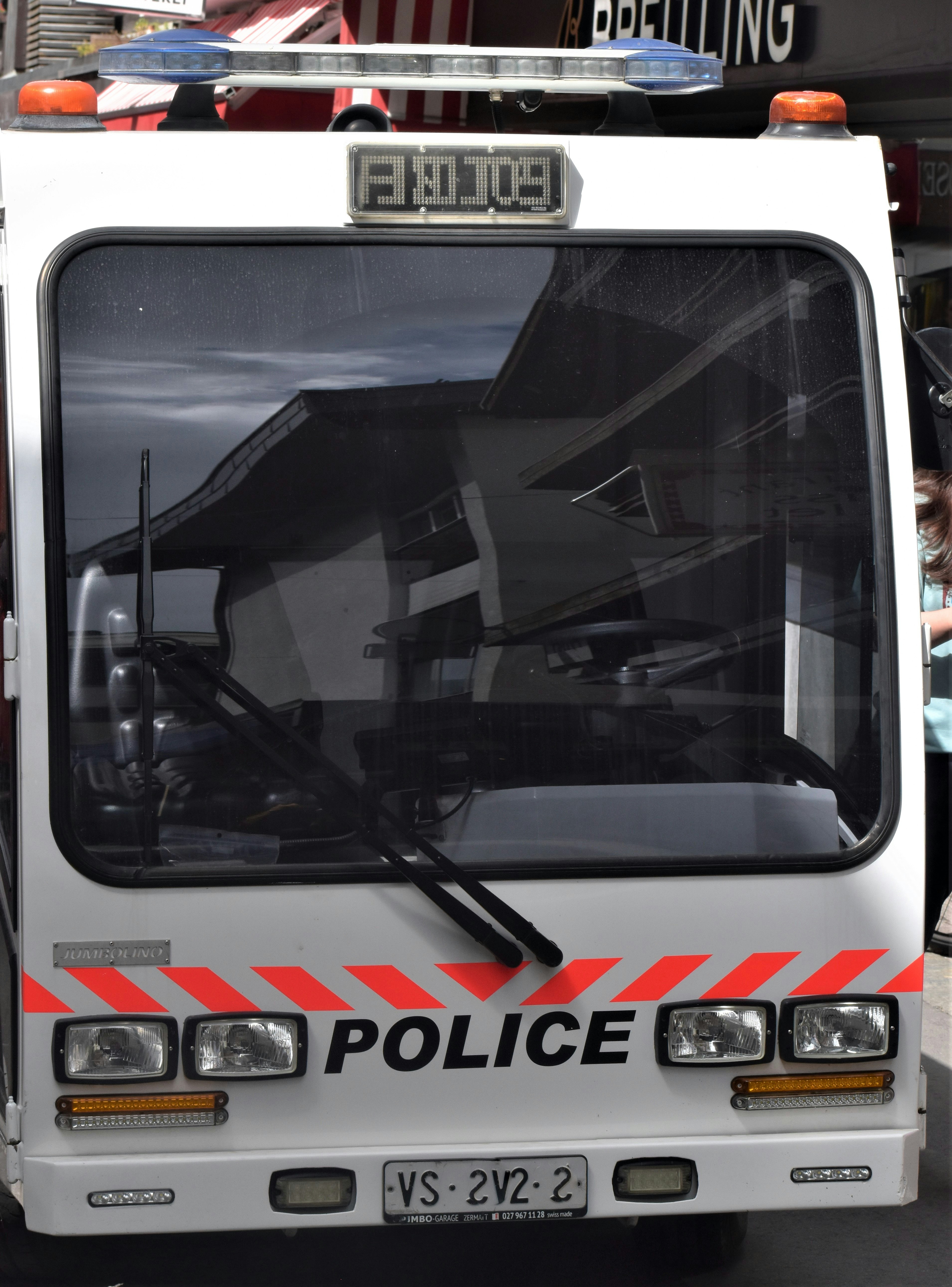 a police truck parked in front of a building