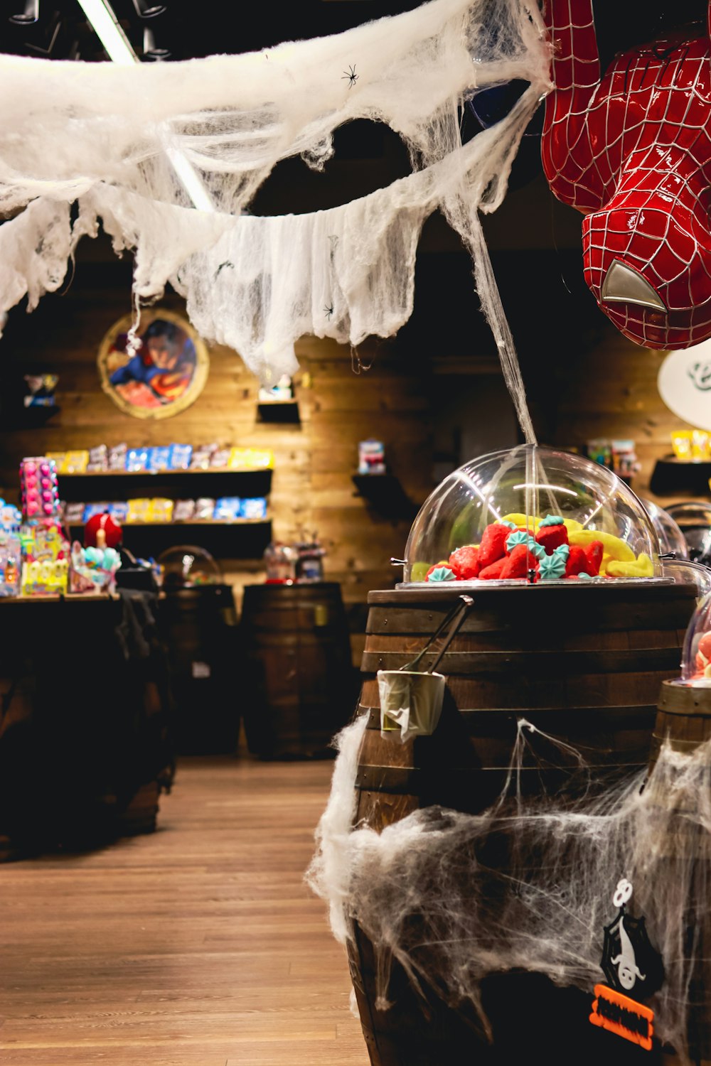 a store with a spider web hanging from the ceiling