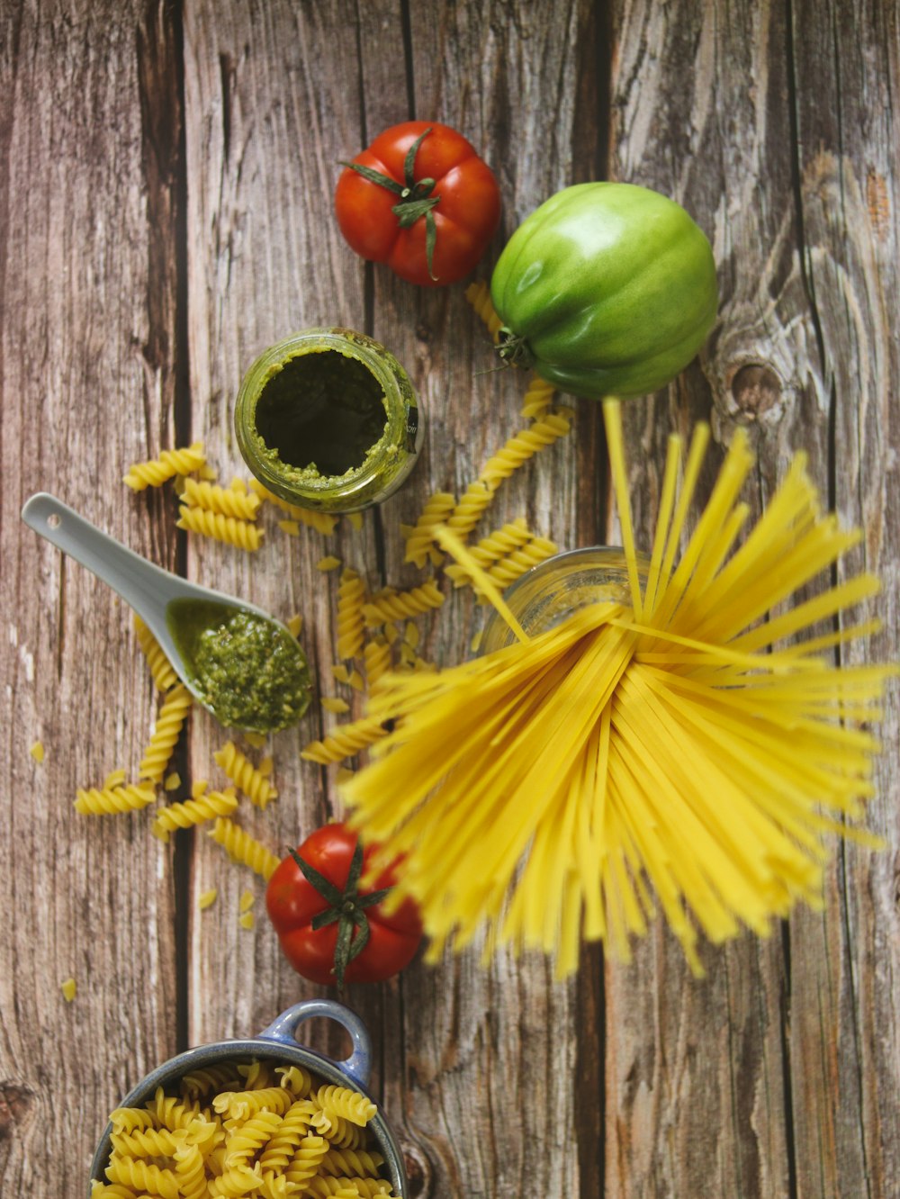 a table topped with lots of different types of pasta