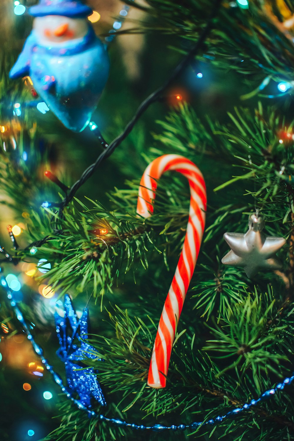 a close up of a christmas tree with ornaments