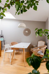 a white table and chairs in a room