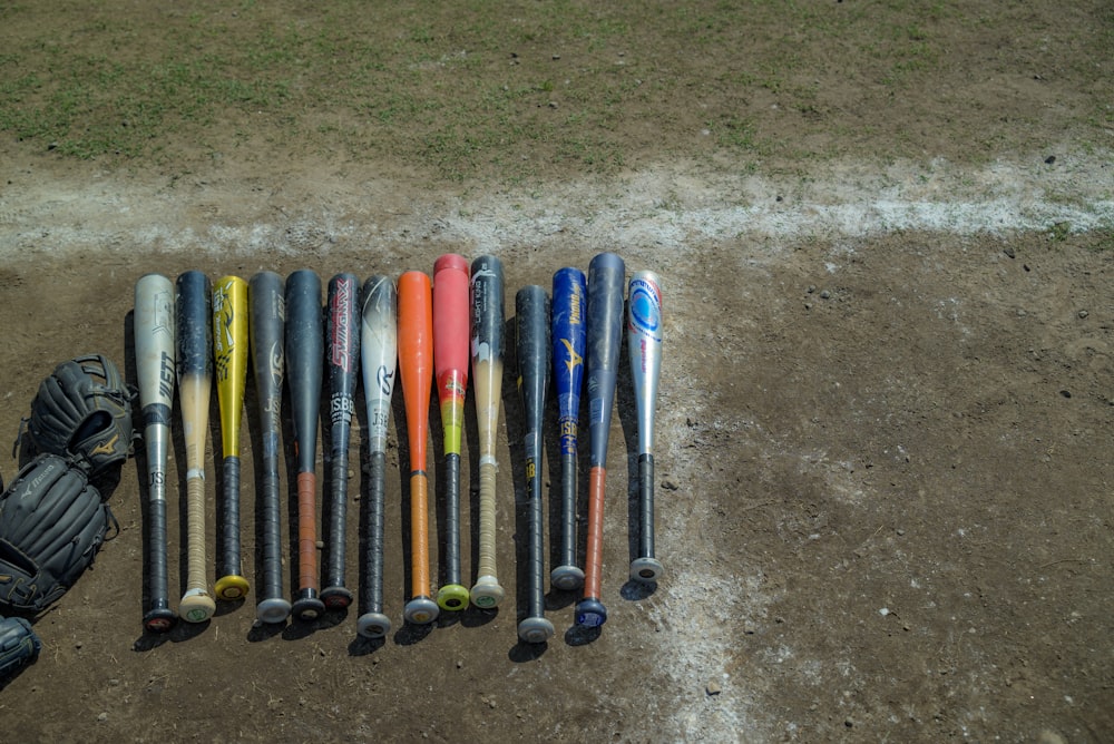 a number of baseball bats on a baseball field
