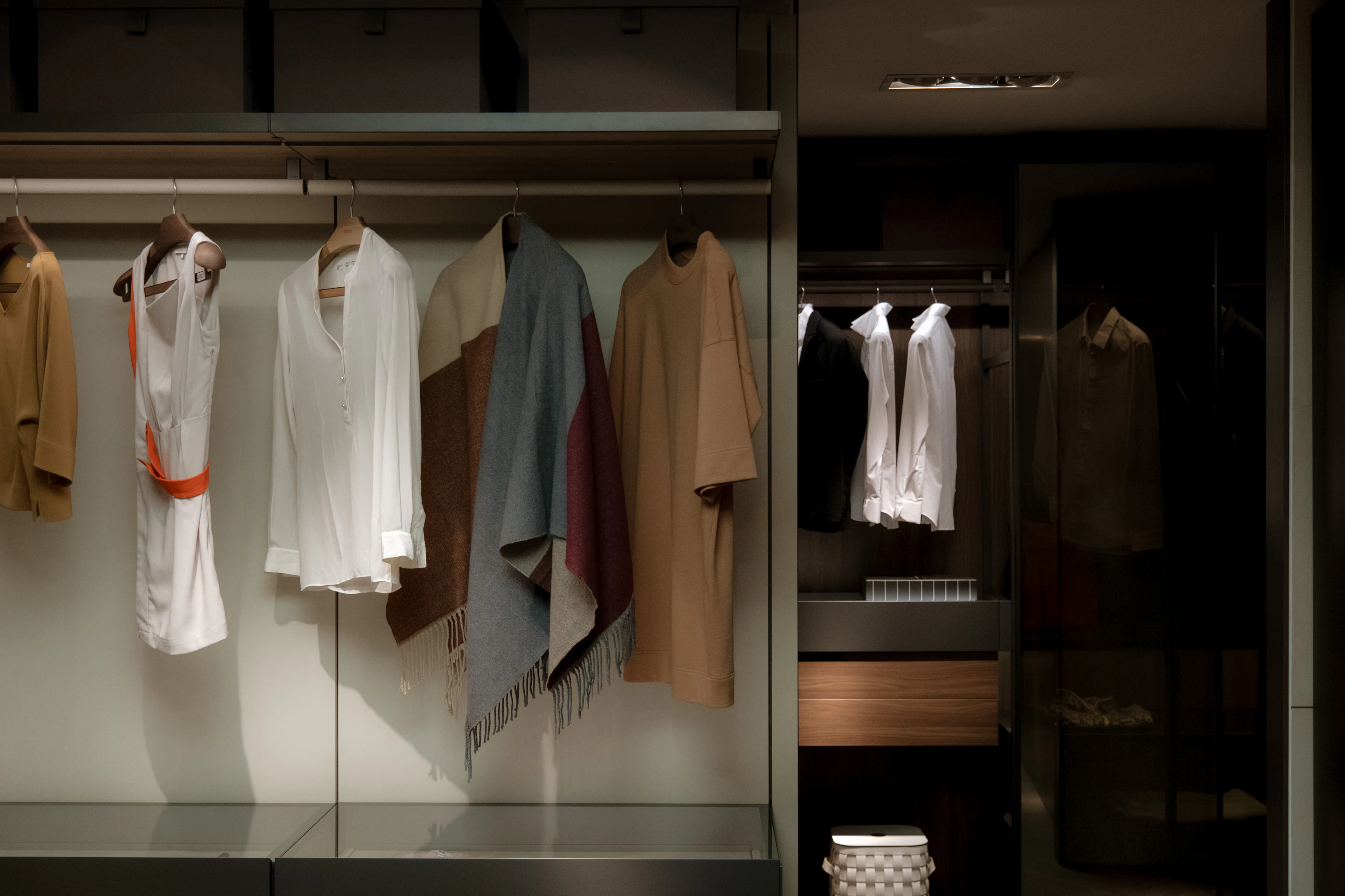 Glass wardrobe with hanging clothes