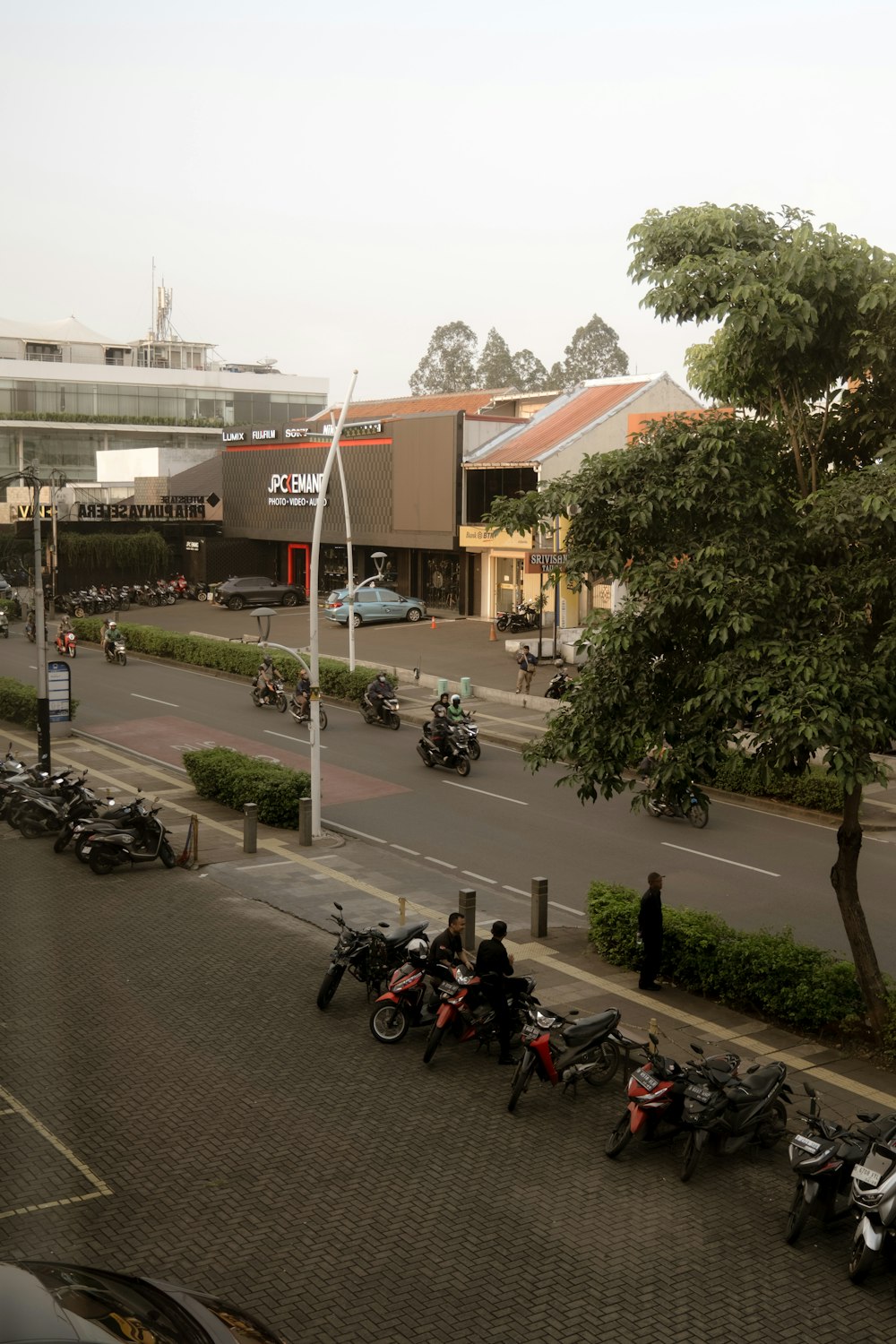 a group of motorcycles parked on the side of a road