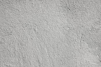 a black and white photo of a concrete wall