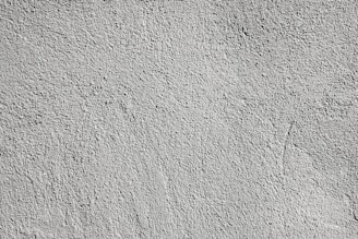 a black and white photo of a concrete wall