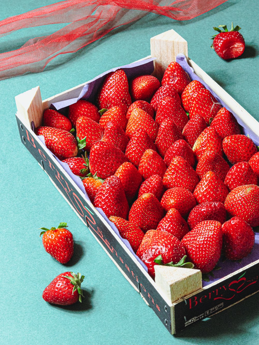 a box of strawberries on a table