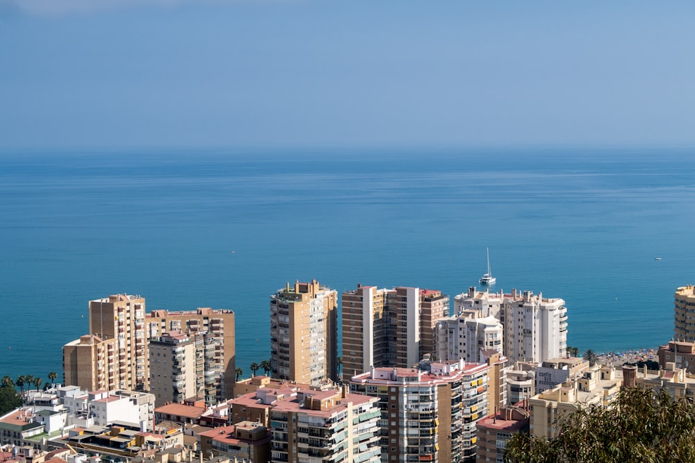 a view of a city with a body of water in the background