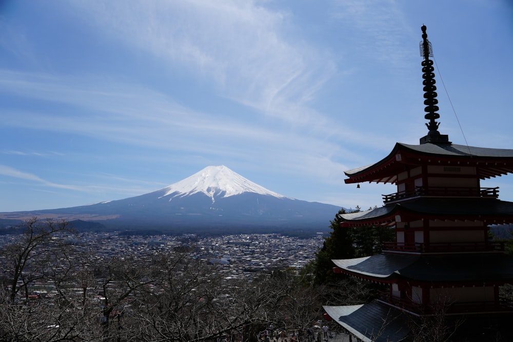 a view of a mountain with a pagoda in the foreground