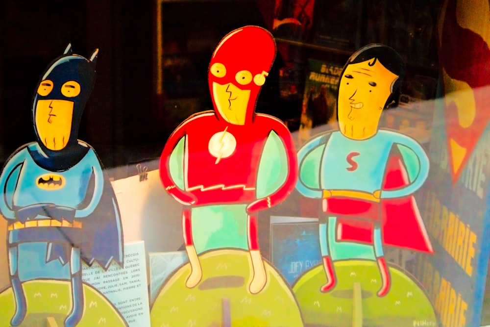 a window display with cut outs of cartoon characters