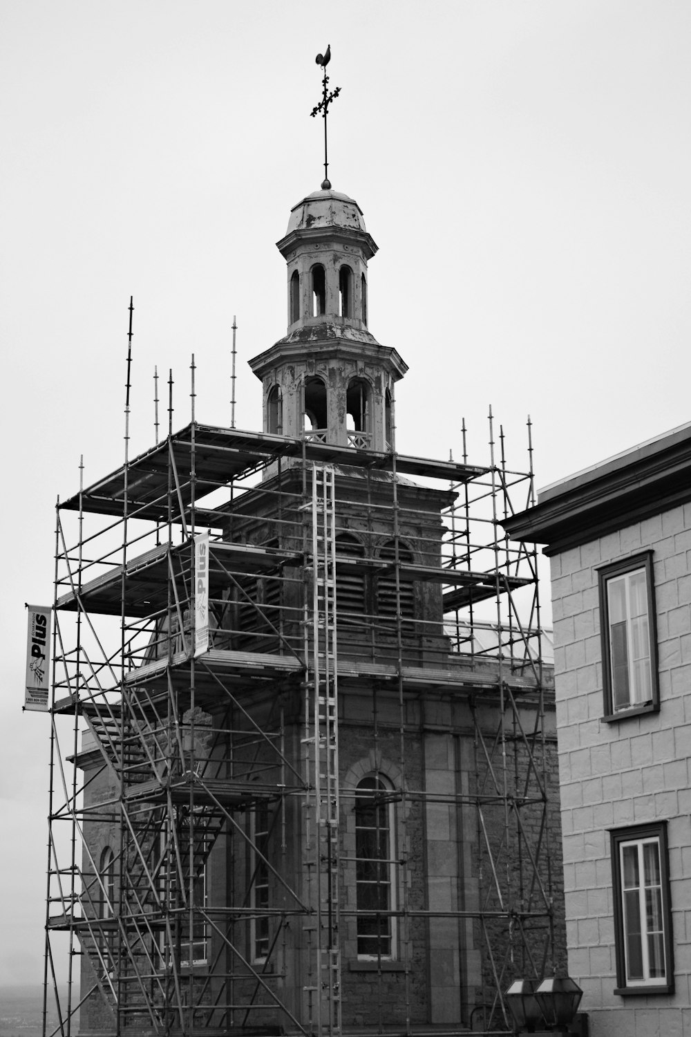 a building with scaffolding around it and a clock tower