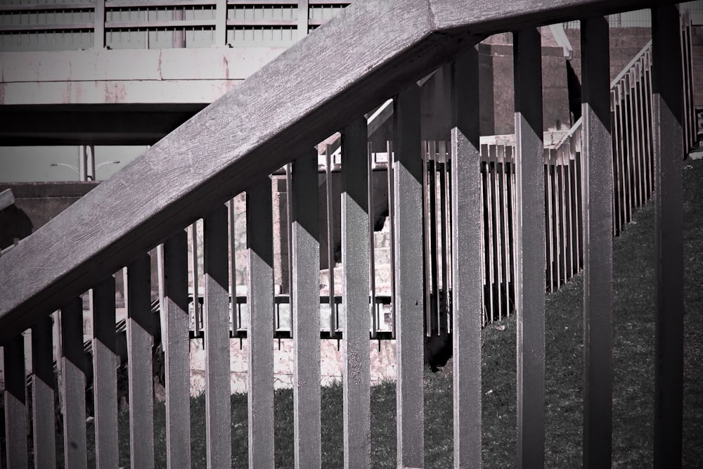 a black and white photo of a railing