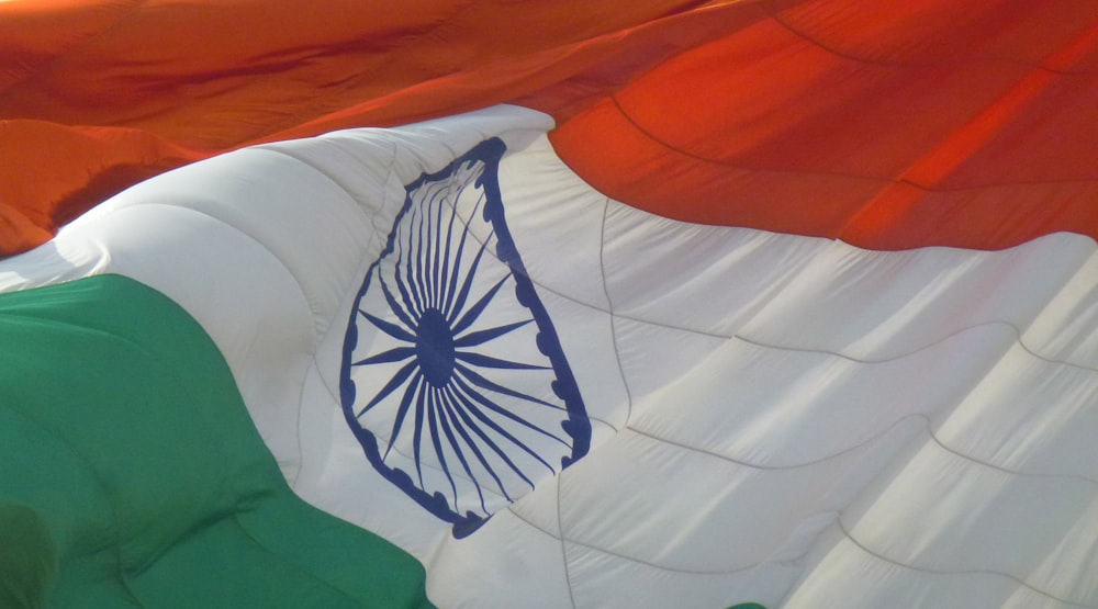 the indian flag is flying in the wind