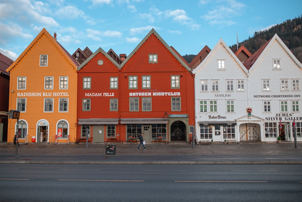 a row of buildings sitting next to each other on a street