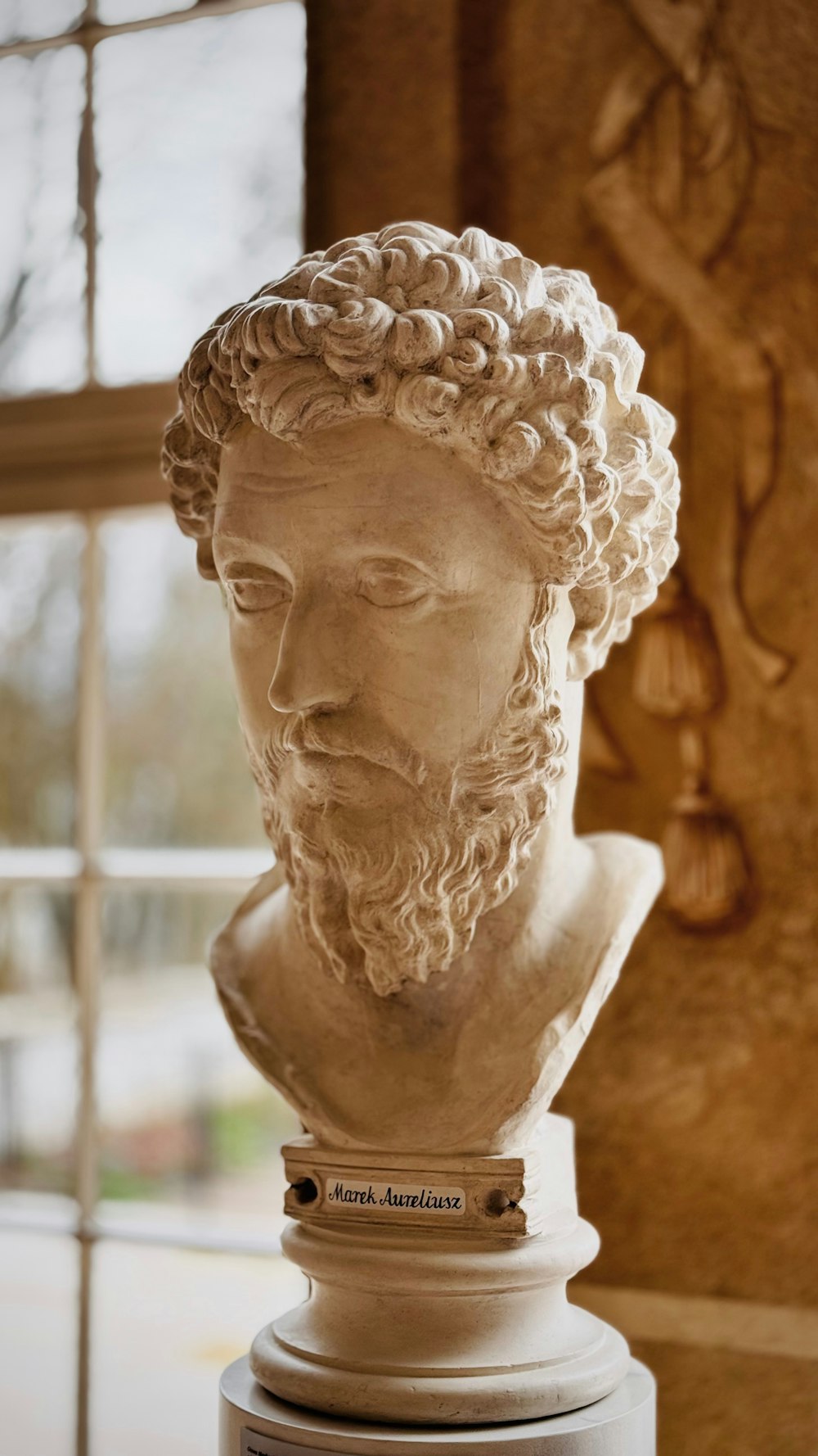a marble bust of a man with a beard