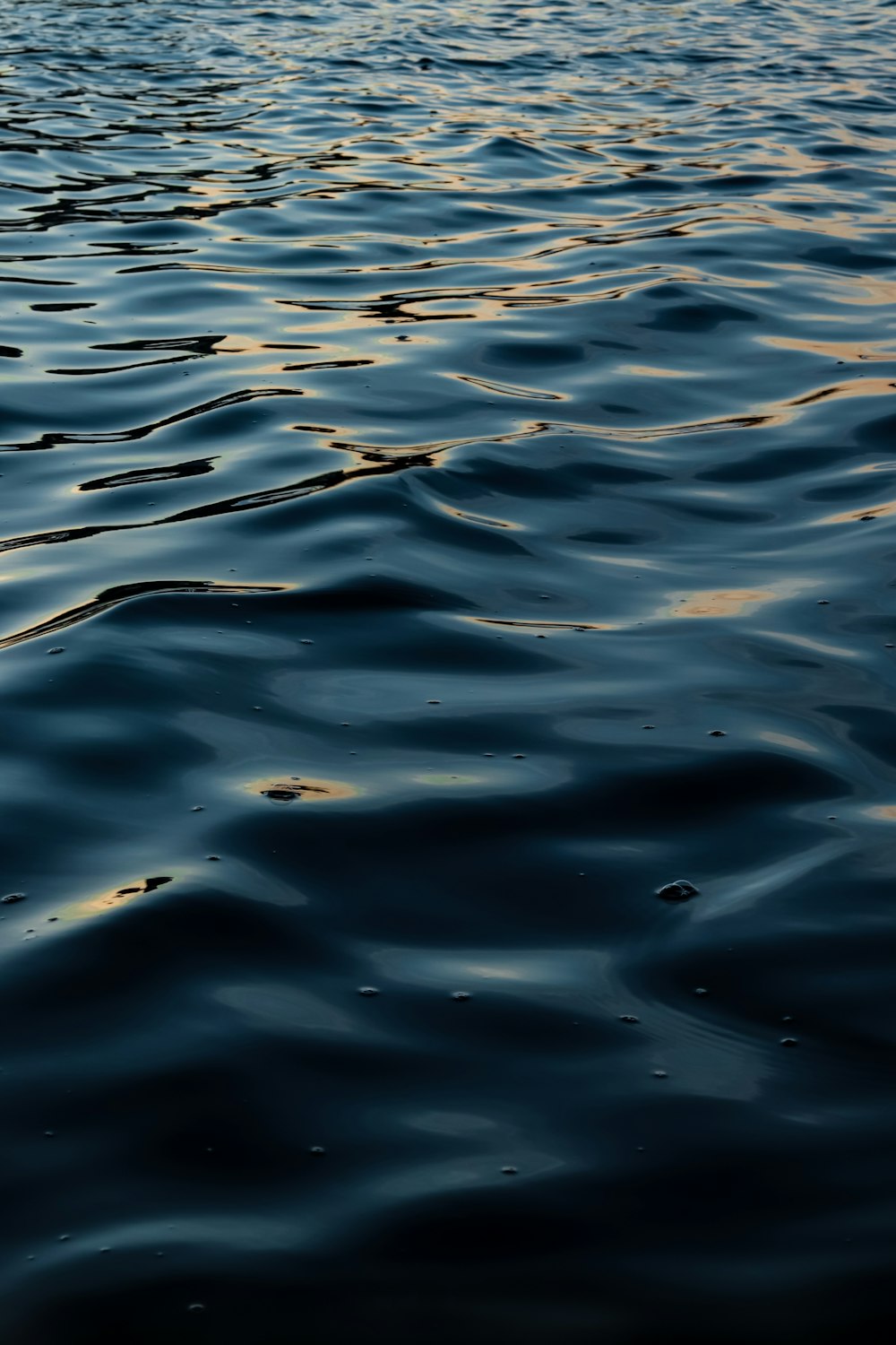 a body of water with a boat in the distance