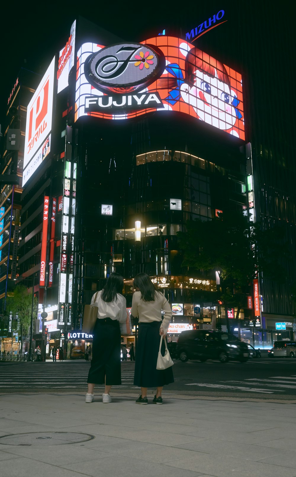 a couple of people that are standing in the street