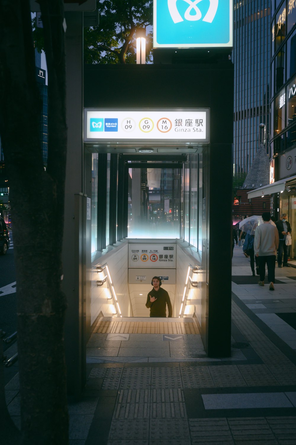 a bus stop with a man standing in the doorway