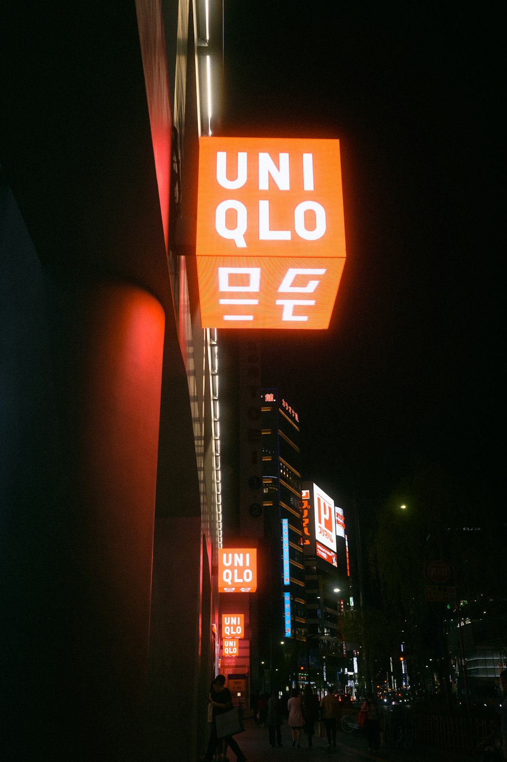 a neon sign on the side of a building