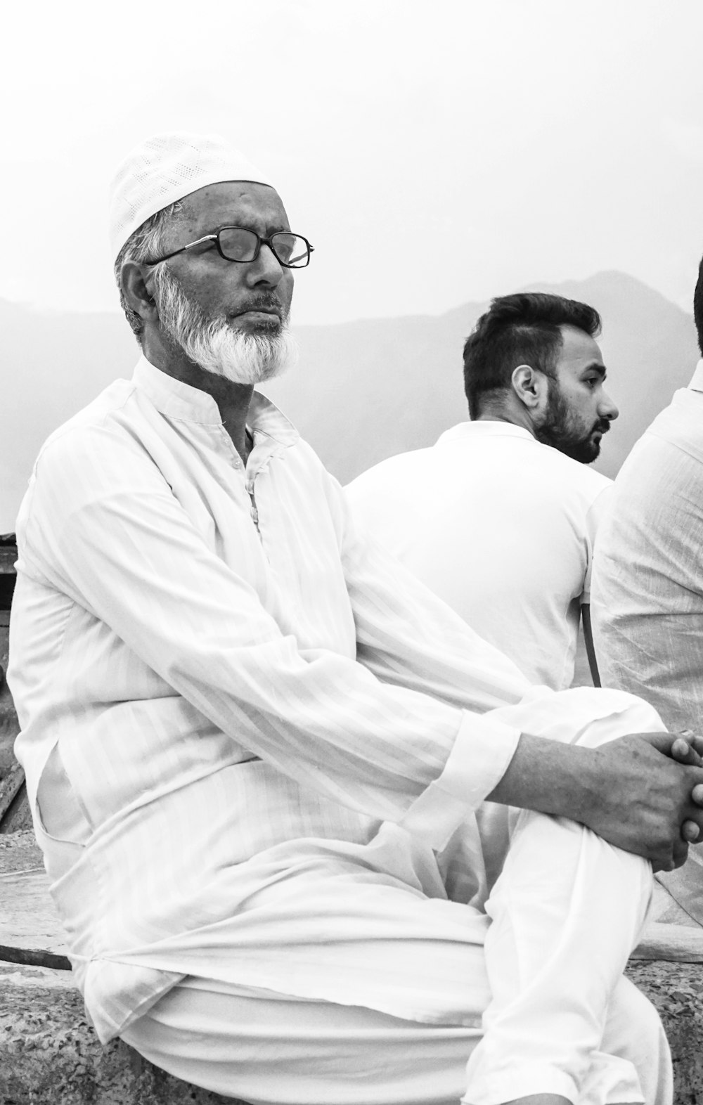 a group of men sitting next to each other