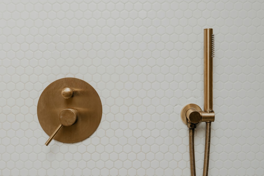 a shower head and shower faucet in a bathroom