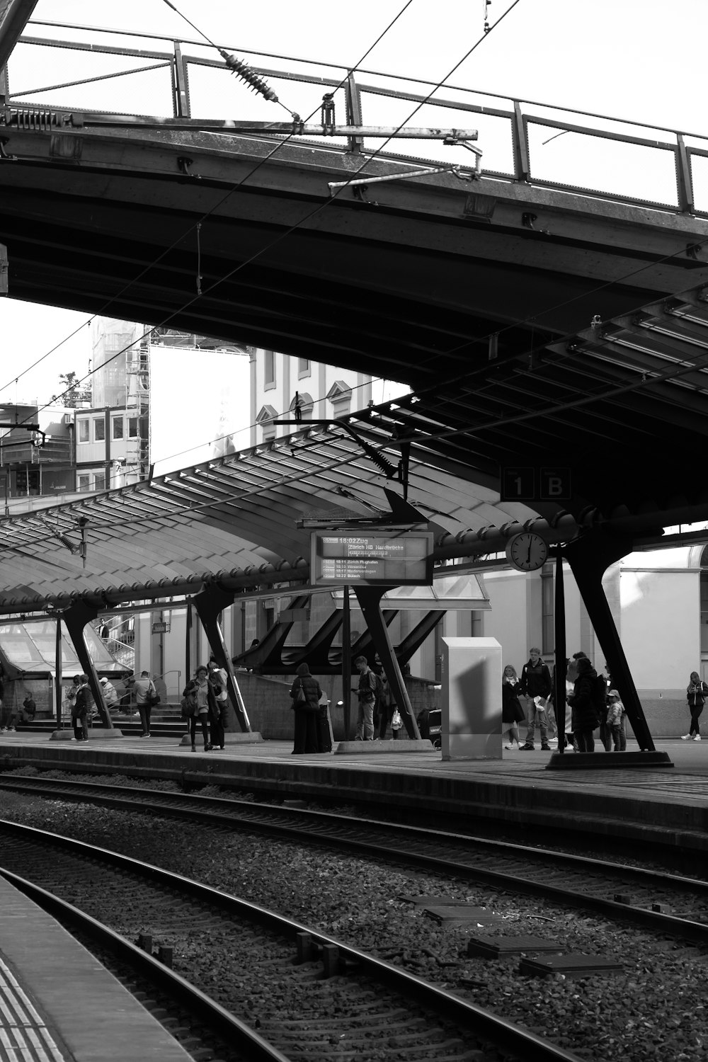 a black and white photo of a train station