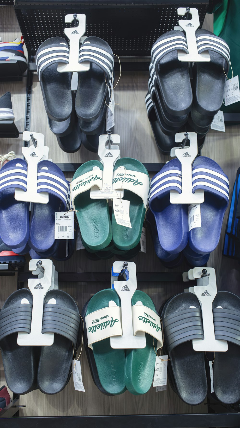 a display of sandals and slippers for sale