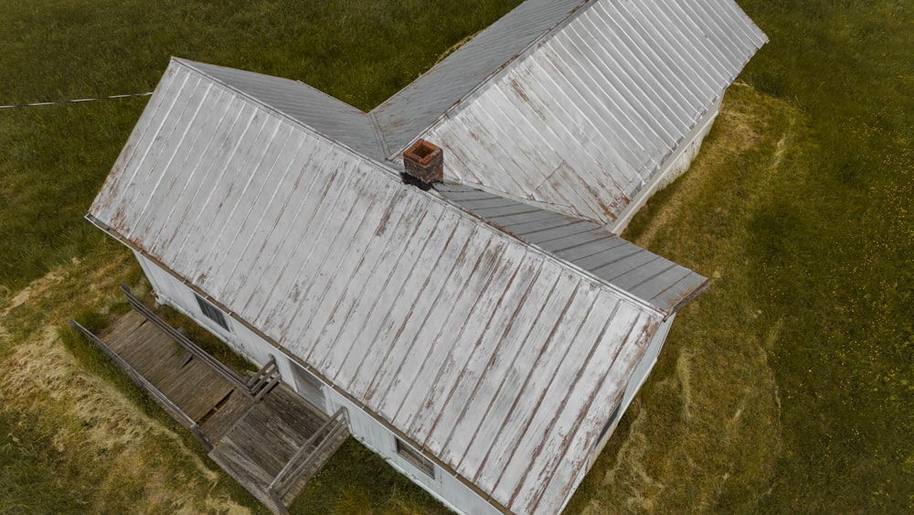 an aerial view of a building with a person standing on the roof