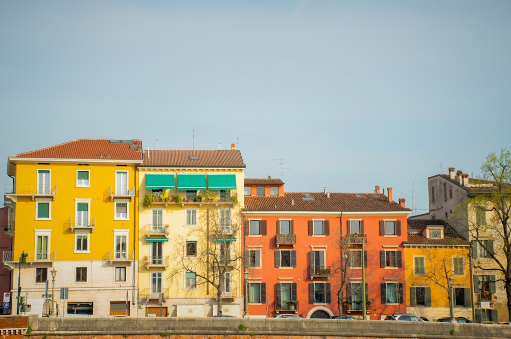 a row of colorful buildings next to a bridge