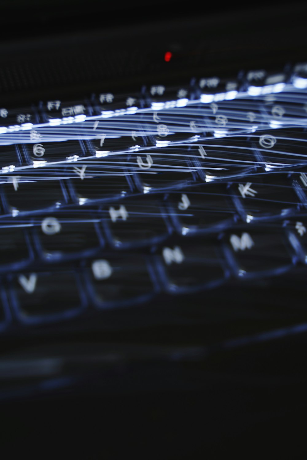 a close up of a keyboard with a blurry background