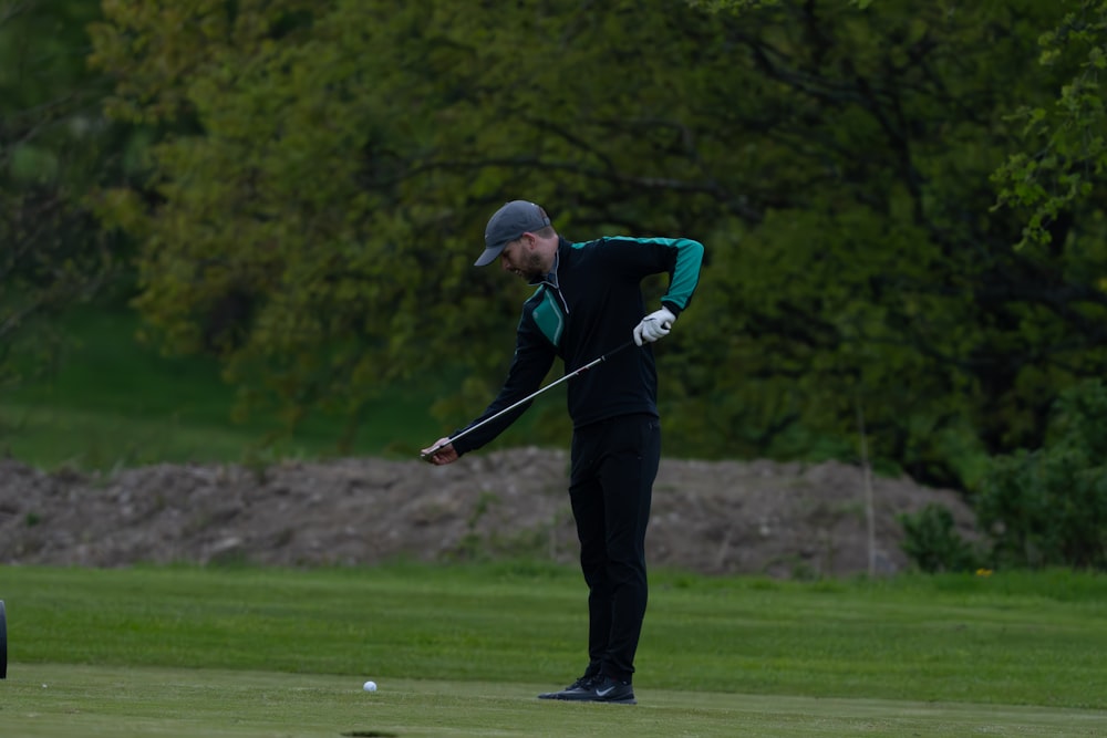 a man playing golf on a golf course