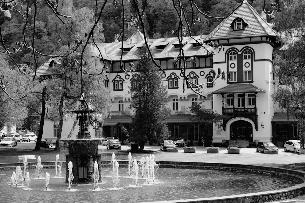 a large building with a fountain in front of it