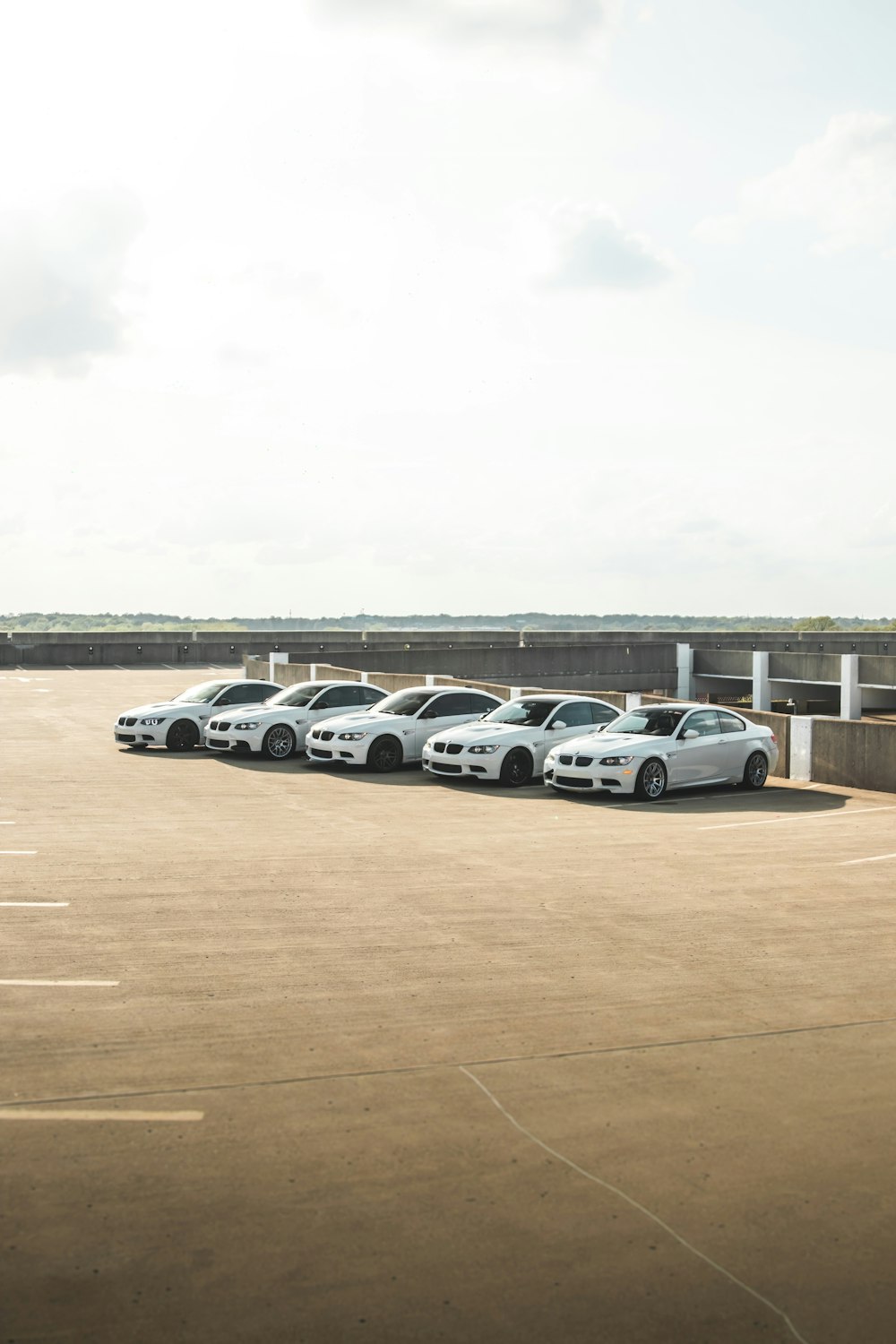 a row of parked cars in a parking lot