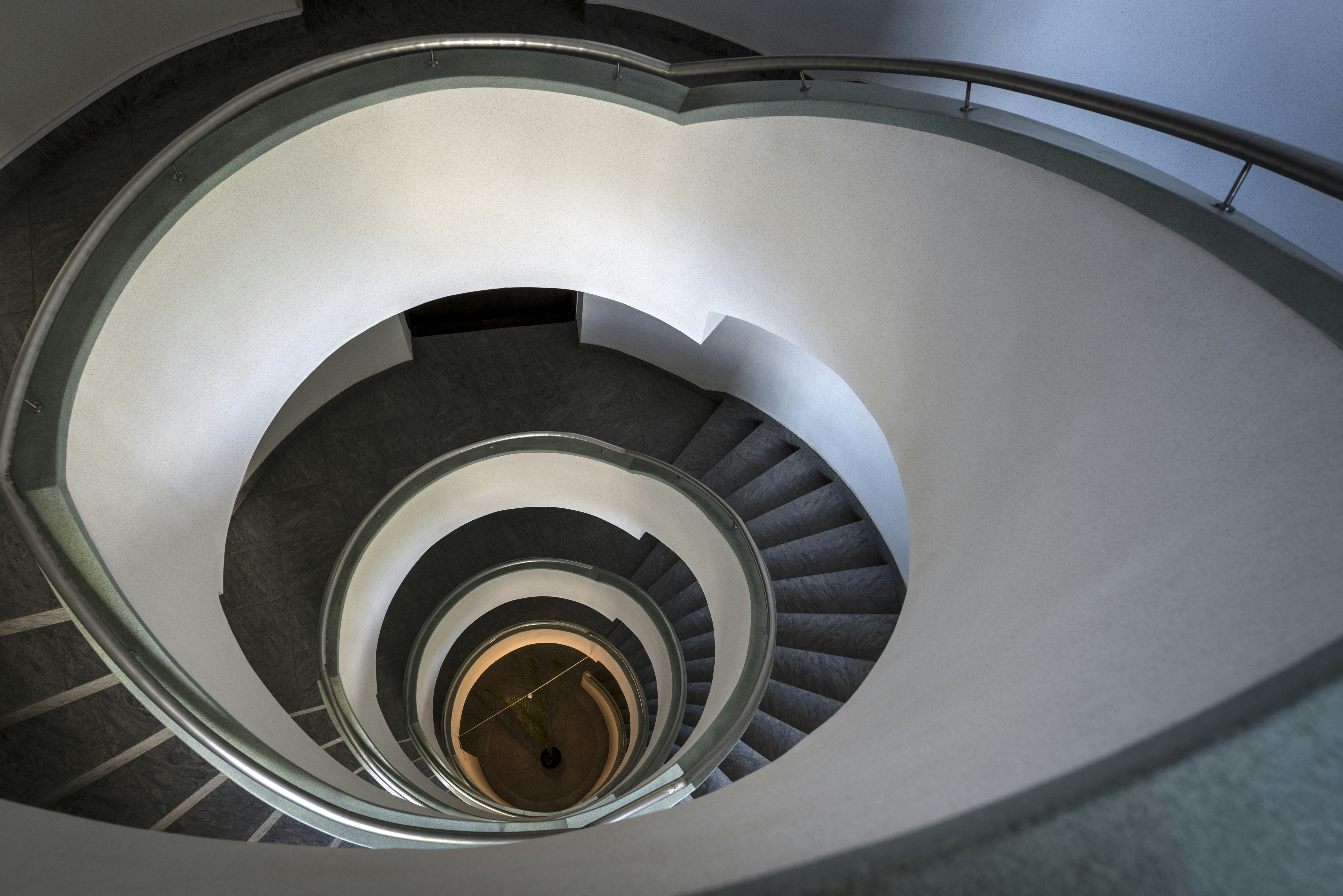 a view of a spiral staircase from the bottom
