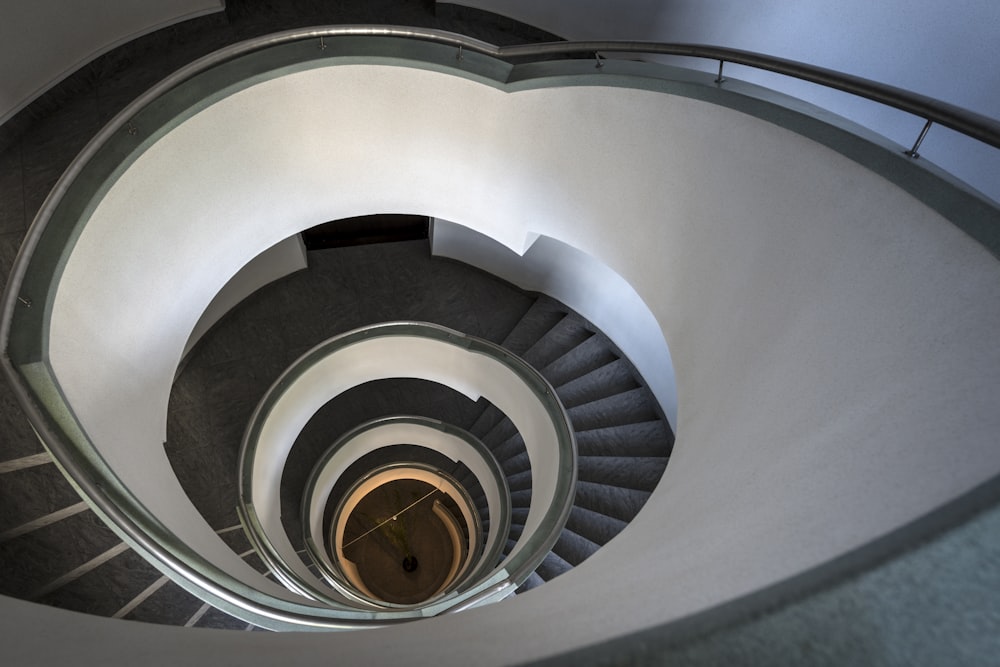 a view of a spiral staircase from the bottom