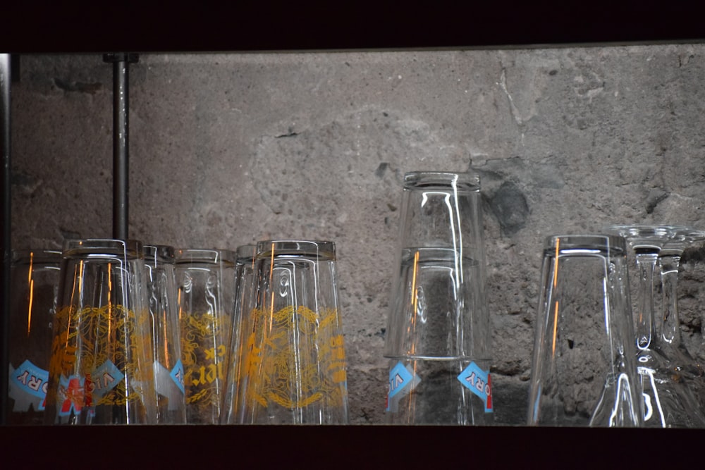 a group of glass vases sitting next to each other