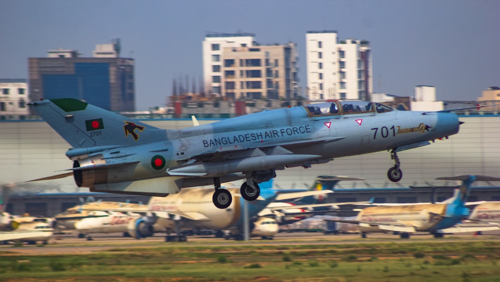 a fighter jet taking off from an airport runway