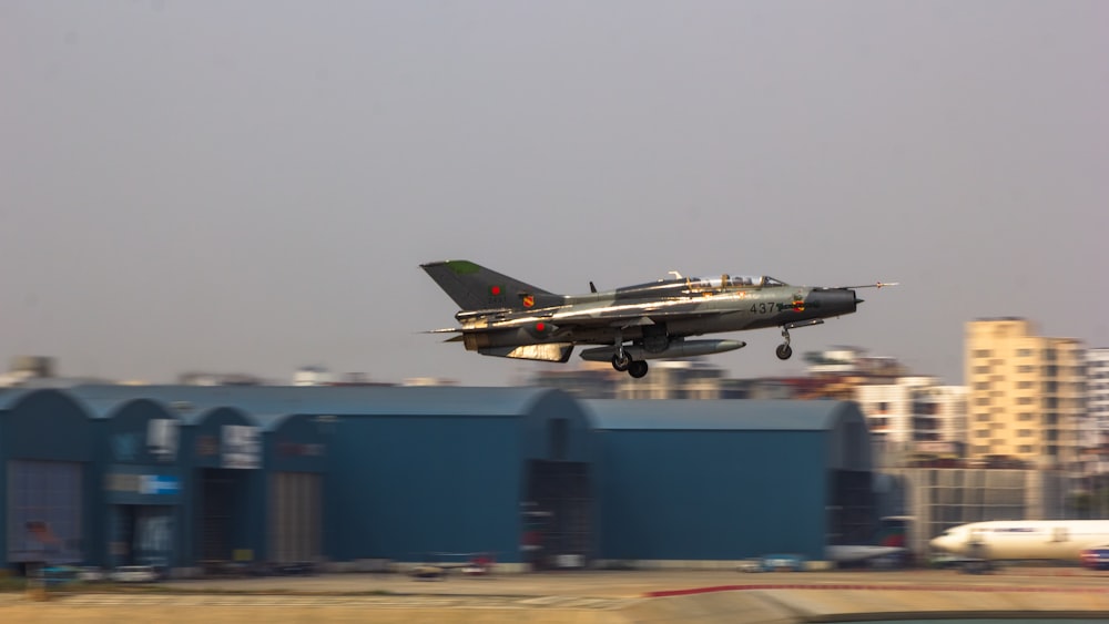 a fighter jet taking off from an airport runway