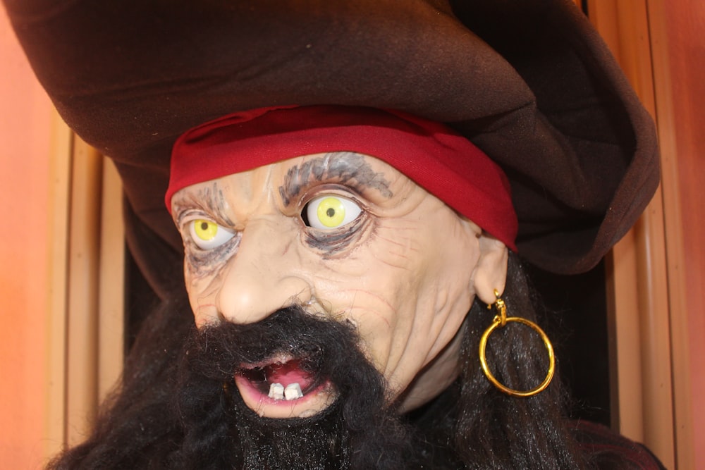 a close up of a person wearing a pirate costume